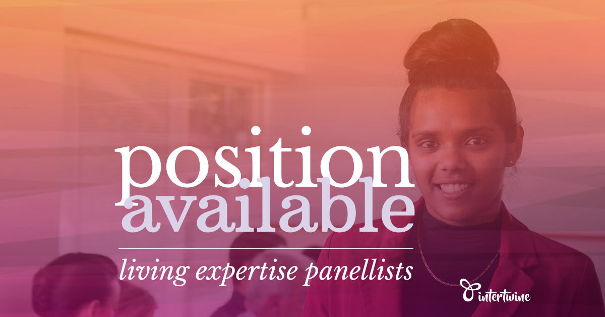 position available: living experience panellist (image is of a young first nations woman standing with an iPad in front of a meeting of people in suits. She is wearing a red suit jacket over a black top.)